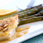Zesty Baked Lemon Cod with Crispy Roasted Asparagus Delight